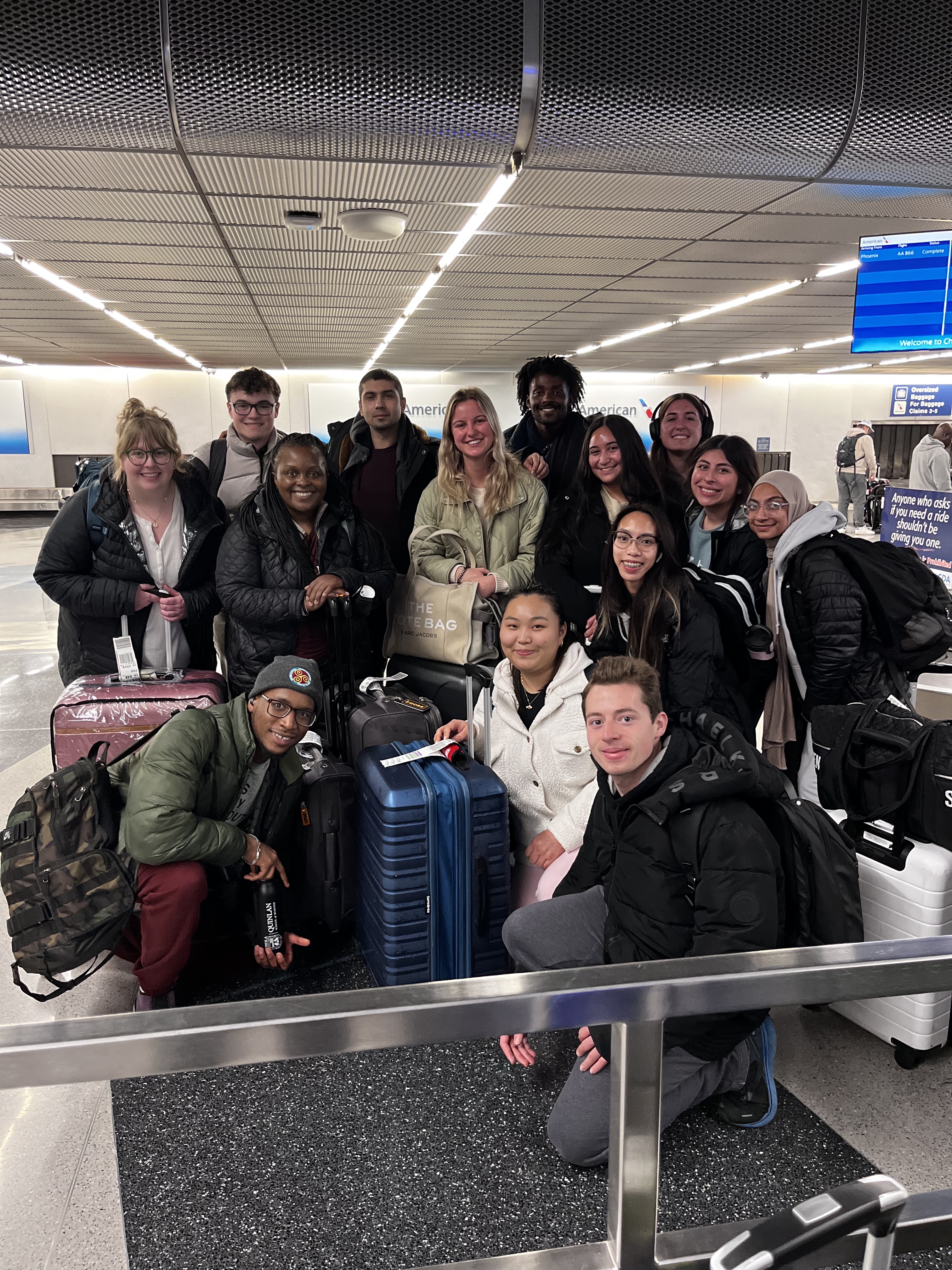 The group of Quinlan Ramble to San Francisco students pose for one last group photo at baggage claim in O'Hare airport.